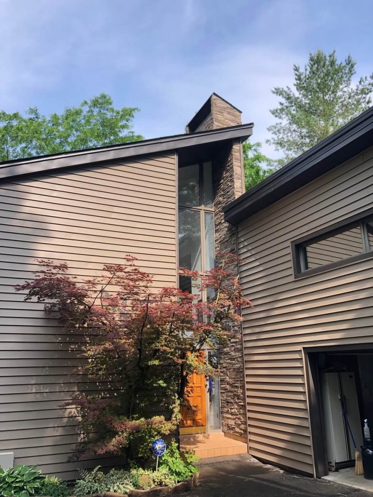 A home finished with new cedar shingle siding