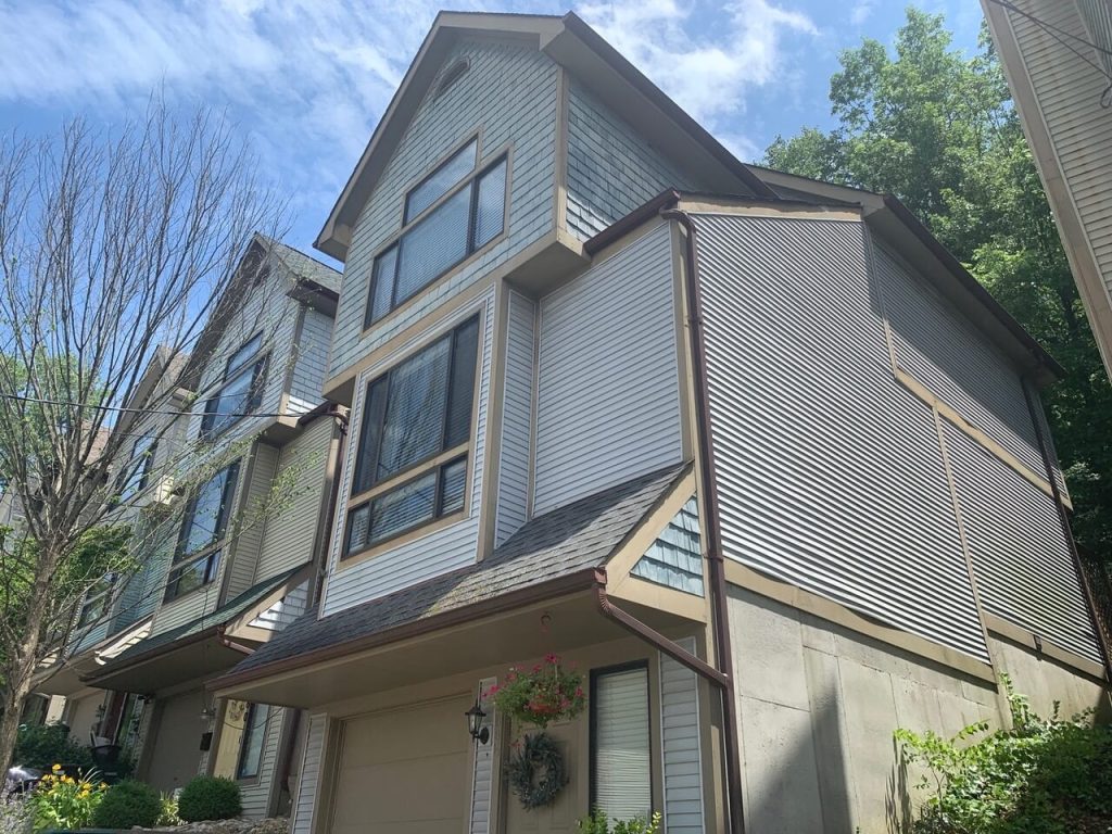 A finished two-story house with lap siding and white trim