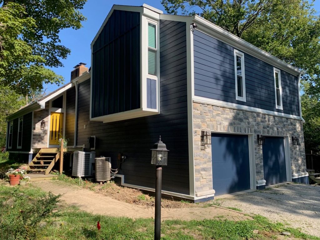 A house with an exterior door and new siding